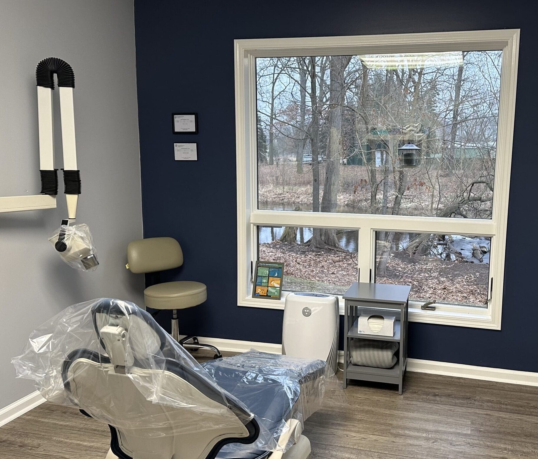 Private periodontal treatment room at Elkhart Periodontics featuring advanced dental equipment and a peaceful creek view to support stress-free gum disease treatment.